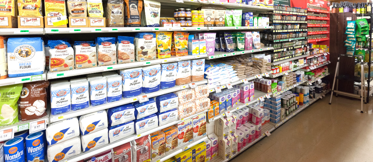 Photo of grocery store aisle with products including flour and sugar