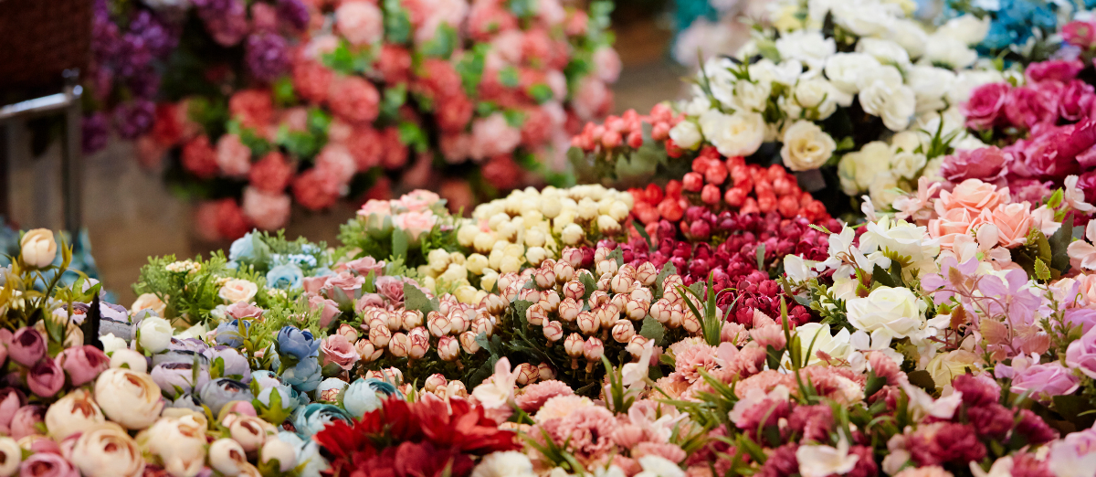 close up photo of a wide range of cut flowers in a flower shop
