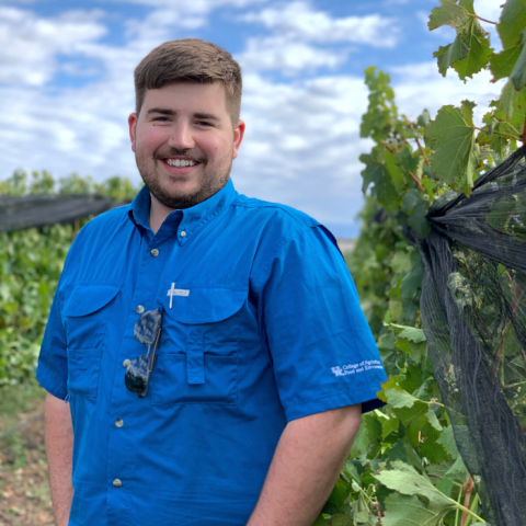 Sam Leneve standing in a vineyard in Argentina