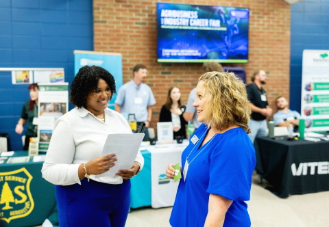 Current student, Gabby Carter speaking with Farm Credit Mid-America representative Andrea Diebold at the 2024 Agribusiness and Industry Career Fair on September 18th, 2024